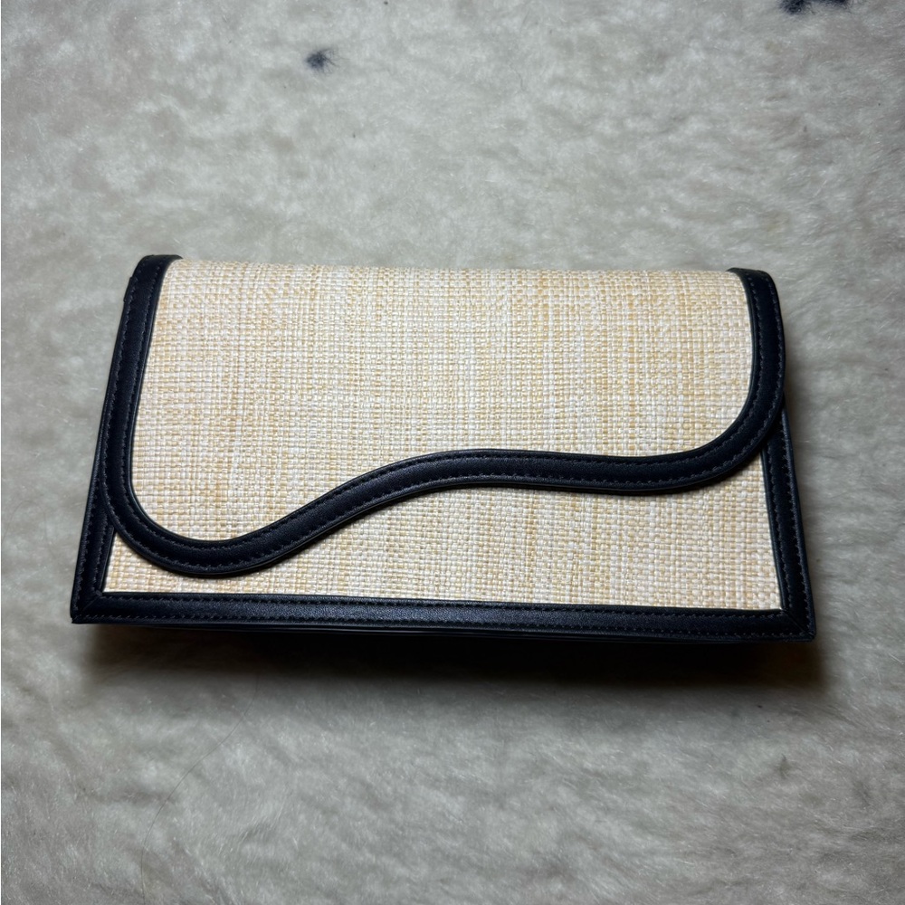 Cute structured, cream and black purse. Never been used.